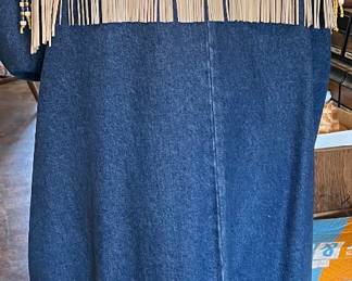 Back of blue jean and leather coat