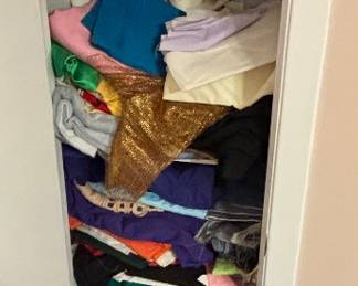 A whole closet filled top to bottom with sewing fabric