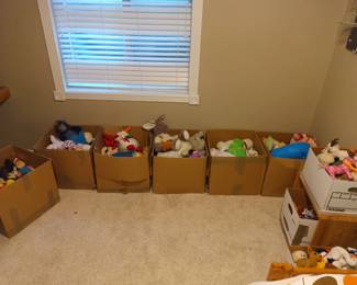 lots of stuffed animals and beanies