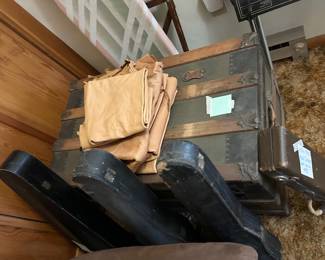 Early 20th century violins, steamer trunk and tanned hides!
