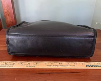 H44 - $70. 1980s Vintage Coach Taylor Black Leather Crossbody Bag. Measures 11.5" x 4" x 8" tall. 