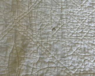 H51 - $30. Hand Quilted Blanket. Measures 60" x 75". Does have a small ink stains, small holes & discoloration throughout.  