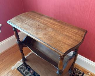 H29 - $30. Wooden Side Table. Measures 22" wide x 11" deep x 23" tall. 