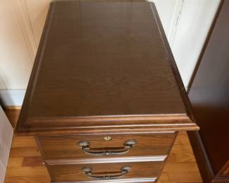 H19 - $10. 2 Drawer Wooden Filing Cabinet. Measures 18.25" wide x 26.5" deep x 29.5" tall. Some surface scratches and we do not have the key. 