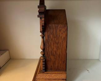 H23 - $60. 1890s Antique American Ansonia Pulford Oak Mantle Clock. Measures 11.75" x 14.75" tall. Chimes but does not work correctly. 