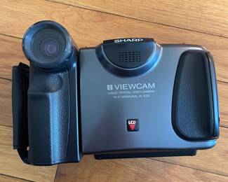 H43 - $25. Sharp Video Camera Model VL-E33U Case & Charger. 