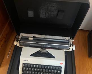 H41 - $180. Olympia 1970s SM9 Deluxe Typewriter. Wide Carriage with Case. Works. 