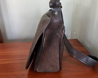 H48 - $100 Vintage 1970s Coach NYC Messenger Bag - Black Leather. Measures 10" wide x 4" deep x 9" tall. 