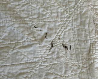 H51 - $30. Hand Quilted Blanket. Measures 60" x 75". Does have a small ink stains, small holes & discoloration throughout.  