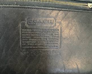 H44 - $70. 1980s Vintage Coach Taylor Black Leather Crossbody Bag. Measures 11.5" x 4" x 8" tall. 