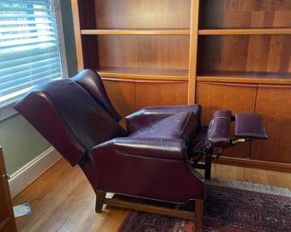 H27 - $30. Well loved leather recliner. Measures 32" wide x 31" deep x 39" tall. Cracking on arms.