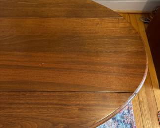 H57 - $75. Wooden Oval Coffee Table. Measures 54" long x 31.5" wide x 17.5" tall. With the leaves down it is 16.5" wide. 