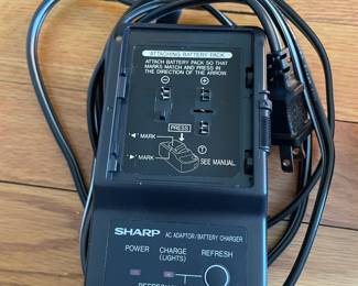 H43 - $25. Sharp Video Camera Model VL-E33U Case & Charger. 