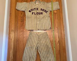 H12 - $175. Childs Wool Baseball Uniform. "White Rose Flour" was the sponsor. Some staining but no holes that I noticed. 