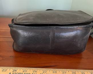 H48 - $100 Vintage 1970s Coach NYC Messenger Bag - Black Leather. Measures 10" wide x 4" deep x 9" tall. 