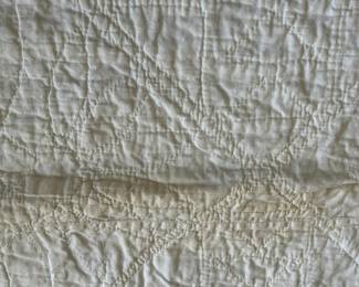 H51 - $30. Hand Quilted Blanket. Measures 60" x 75". Does have a small ink stains, small holes & discoloration throughout.  