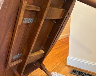 H57 - $75. Wooden Oval Coffee Table. Measures 54" long x 31.5" wide x 17.5" tall. With the leaves down it is 16.5" wide. 