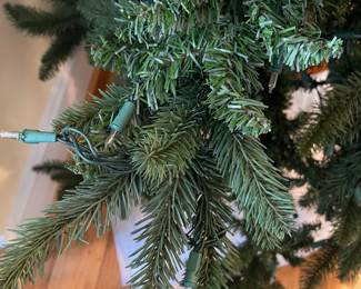 H96 - $15. 7' Tall Christmas Tree. Not prelit - half of the lights don't work as is. (BUT. You have 8/9 months to fix it.)