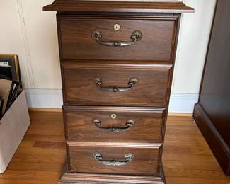 H19 - $10. 2 Drawer Wooden Filing Cabinet. Measures 18.25" wide x 26.5" deep x 29.5" tall. Some surface scratches and we do not have the key. 