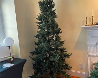 H96 - $15. 7' Tall Christmas Tree. Not prelit - half of the lights don't work as is. (BUT. You have 8/9 months to fix it.)