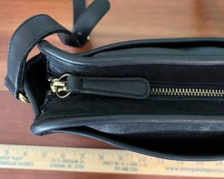 H44 - $70. 1980s Vintage Coach Taylor Black Leather Crossbody Bag. Measures 11.5" x 4" x 8" tall. 