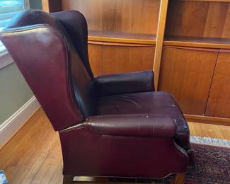 H27 - $30. Well loved leather recliner. Measures 32" wide x 31" deep x 39" tall. Cracking on arms.