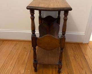 H29 - $30. Wooden Side Table. Measures 22" wide x 11" deep x 23" tall. 
