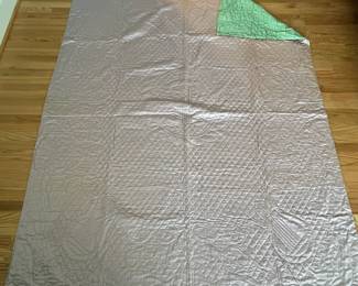 H53 - $85. Reversible Green & Purple Silk (?)  Quilted Blanket. Hand Quilted, Hand Sewn Binding. Measures 68" x 88". 