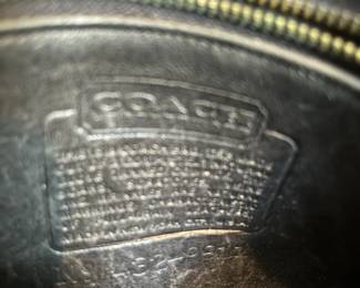 H48 - $100 Vintage 1970s Coach NYC Messenger Bag - Black Leather. Measures 10" wide x 4" deep x 9" tall. 