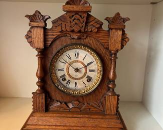 H23 - $60. 1890s Antique American Ansonia Pulford Oak Mantle Clock. Measures 11.75" x 14.75" tall. Chimes but does not work correctly. 