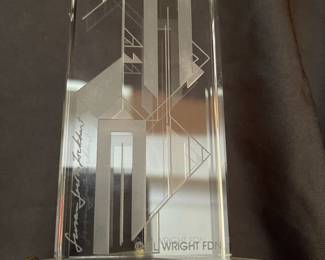 H95 - $100. "Harmonics Award" Column of Starphire Crystal designed by Susan Jacobs Lockhart in the spirit of Frank Lloyd Wright. Measures 15.5" tall. Etched on both sides showing various designs depending on viewpoint. Base has a hole and can be lighted. 