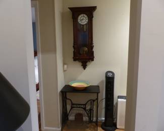 Antique Singer sewing machine base with table top, antique wall clock