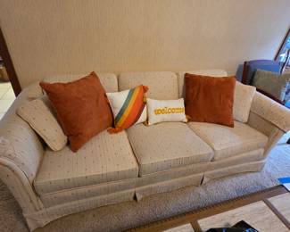 Vintage Striped Upholstered Sofa with Rolled Arms and Skirted Base