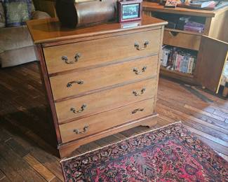 slender chest and vintage throw rug