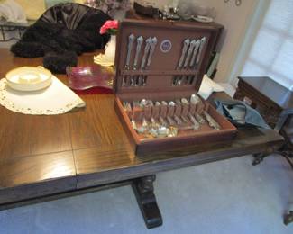 Antique dining table with flatware set