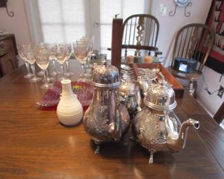 Antique dining table with silver plate tea set