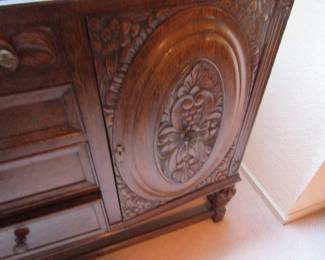 Close up of carved antique sideboard