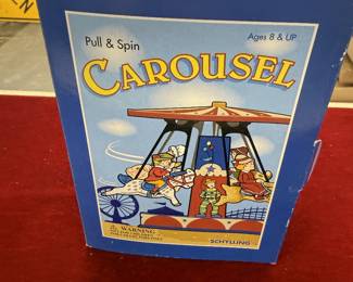 Pull and spin carousel