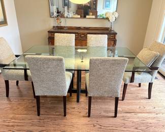 Another view of the glass dining table and 6 chairs, sideboard and mirror