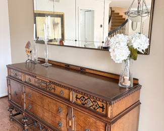 Another view of the sideboard and large mirror