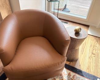 Swivel leather club chair and metal side table