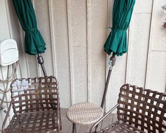 Another view of the Tropitone patio table armchairs (4 available with table) and green patio umbrellas