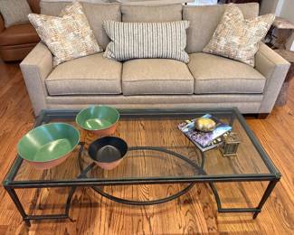 Lexington 3-cushion couch, occasional pillows (sold separately), and glass and metal coffee table