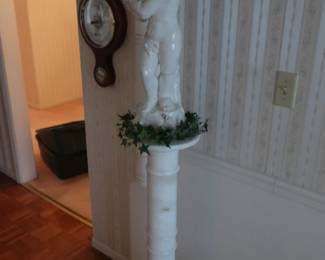 porcelain figure and marble pedestal