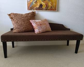 Tufted brown bench/chaise lounge.
