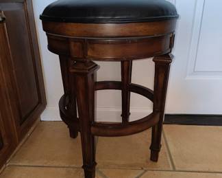 Ornate carved barstool. Classic style.