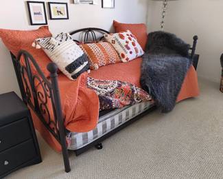 Black metal daybed frame (mattress and bedding not included).