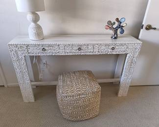 Ornate white carved console.