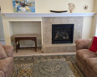 Living room view with original painting by Broadmoor Art Academy artit, Alyda Powel.  Modernist etched table made in Italy by G. Urso.; Alaskan art on mantle