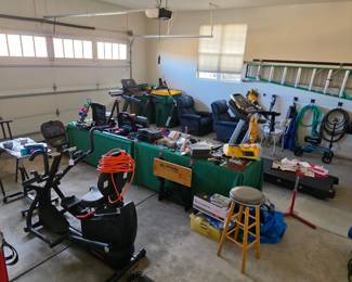 Garage view including like-new exercise equipment